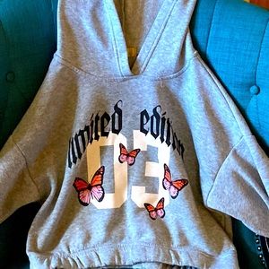 I am selling a used shirt that has butterflies on it